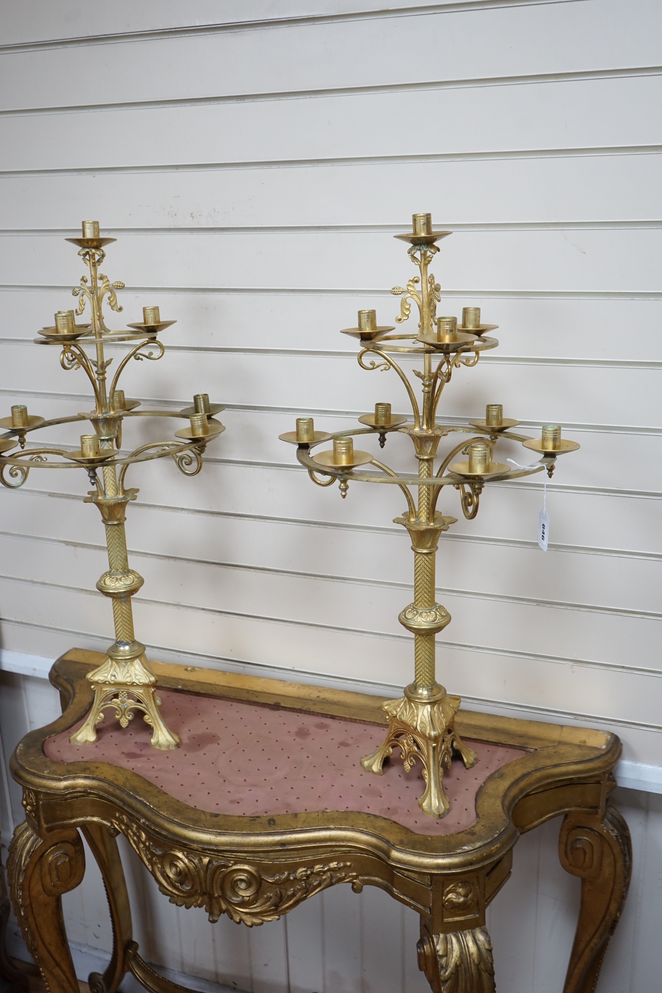 A pair of French neo-gothic ormolu two tier ten light candelabra. 83cm tall